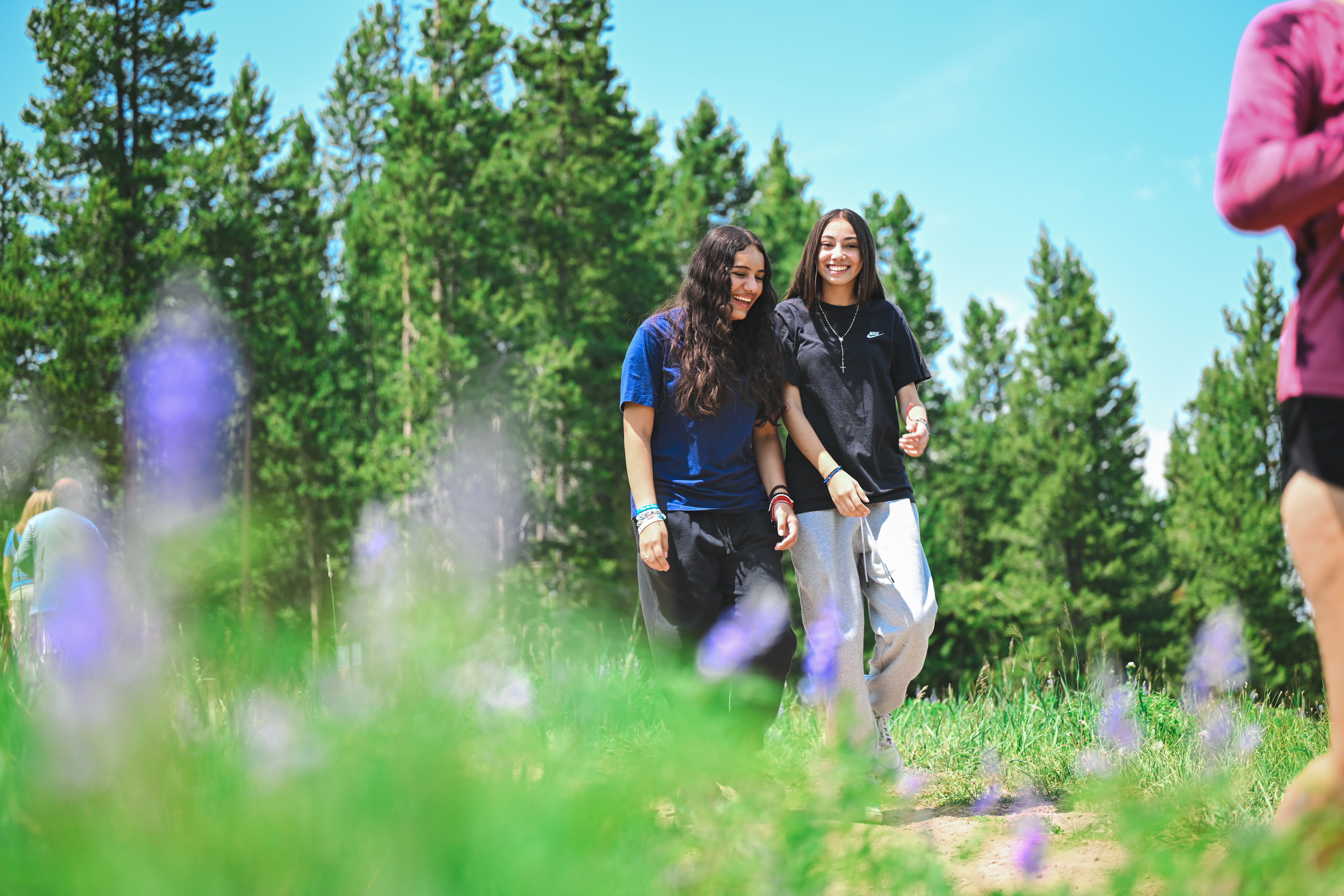 Two women hiking together on a trail in the Vail Valley through the Soul Dirt outdoor belonging program