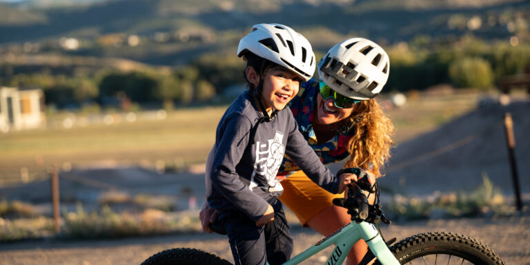 adult and child biking together outdoors through Soul Dirt program in Eagle County