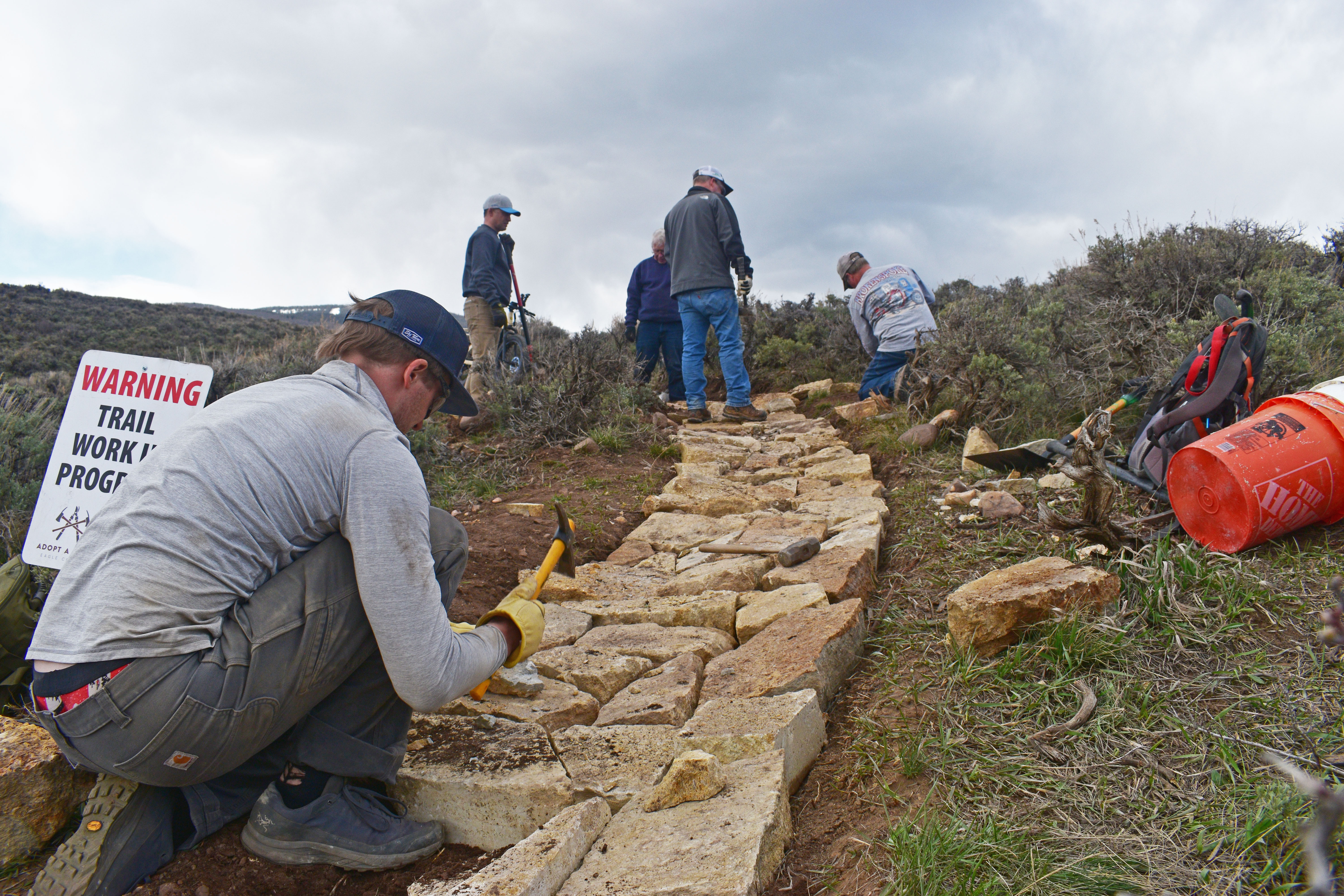 Adopt A Trail Eagle County volunteers building rock tread on an Eagle County trail