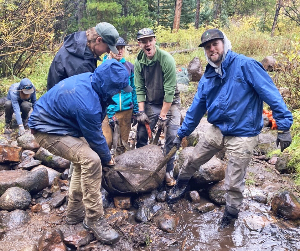 VVMTA Trails and Stewardship Crew hauling rock to build a creek crossing near Grouse Lake