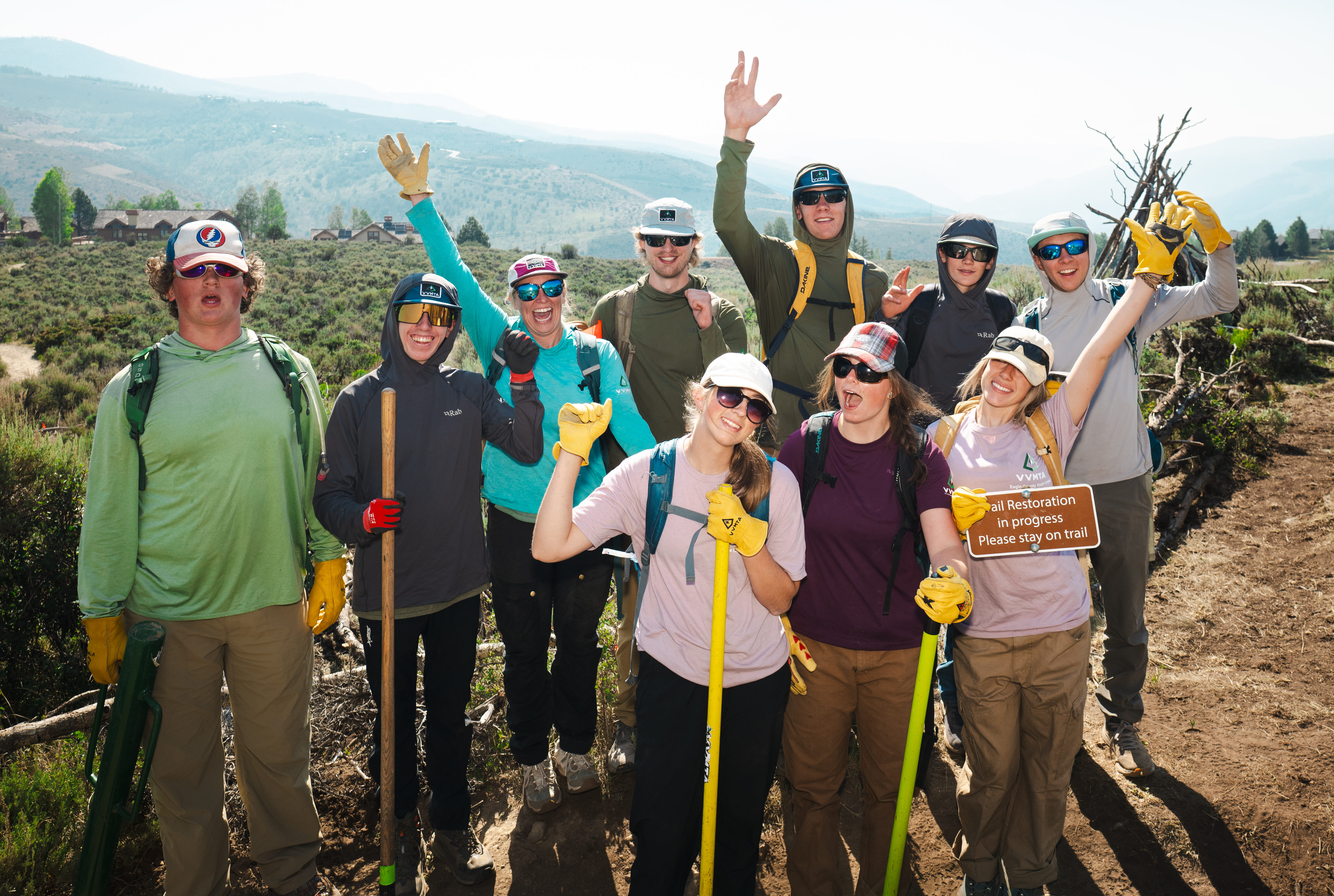 Eagle County Youth Corps crew celebrating together after a trail restoration project