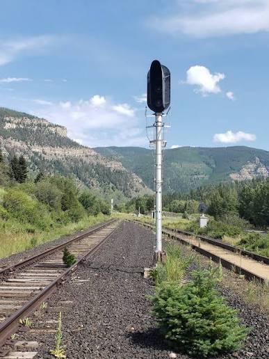 Close-up of a dormant rail signal on the Tennessee Pass line with Eagle River valley mountains behind